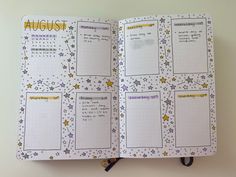 an open planner book with stars on it