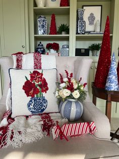 red, white and blue christmas decorations in a living room