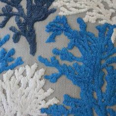 blue and white corals on grey fabric