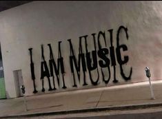 i am music written on the side of a building