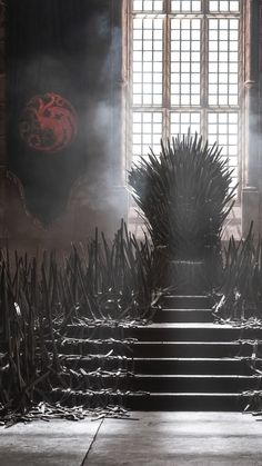 the iron throne sits in front of an open window