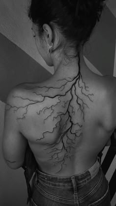 the back of a woman's neck is covered in lightning