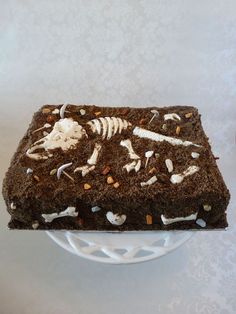 there is a cake that looks like it has skeletons on it and bones in the middle