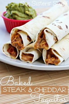 two burritos on a plate with guacamole and salsa