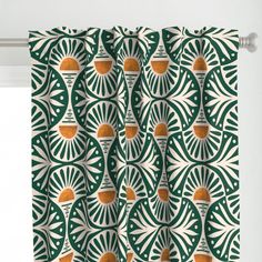 a green and white curtain with an abstract design