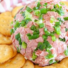 ham and green onion appetizer with crackers on the side, ready to be eaten