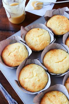 several muffins sitting on top of a metal tray