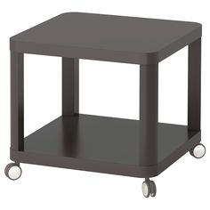 a small gray table with wheels on it