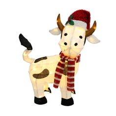 a lighted cow with a santa hat and scarf on it's head is standing in front of a white background