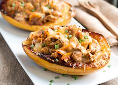 two stuffed sweet potatoes on a white plate