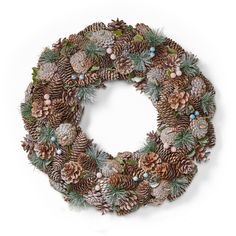 a christmas wreath with pine cones and evergreens on it, measurements for the size