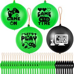 four green frisbees with game on and let's play repeat written on them