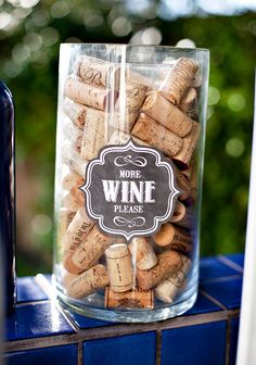 a jar filled with wine corks sitting on top of a table