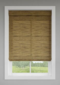 a window with a bamboo blind in front of it and the blinds are closed to let natural light into the room