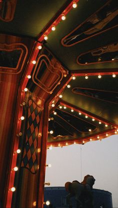 the inside of a bus with lights and decorations on it's sides, including a tie hanging from the ceiling