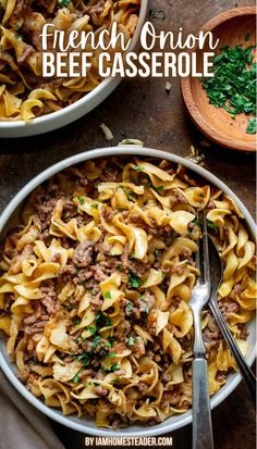 There are two white bowls of French Onion Beef Casserole, one is even in full, the other is only 1/4 in the shot. The full bowl has a fork and spoon in it. There is a small wooden bowl of chopped parsley next to the white bowls, all of these things are on a brown surface. French Onion Beef Noodle Bake 12 Tomatoes, French Onion Beef And Noodles Casserole, What To Make With French Onion Soup, French Onion Soup Hamburger Recipes, Recipe With French Fried Onions, Ground Beef And Onion Soup Mix Recipes, Ground Beef Onion Recipes, French Onion Beef And Rice Recipes, Creamy French Onion Beef And Noodles