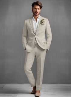 Step up in the sartorial game with our Pure Barn Beige Linen suit. Crafted from pure linen, the suit will carry you through the hot Summer days and crisp evenings with grace, poise, and flair. Add a matching waistcoat, a white shirt and black shoes for stylish outfit.   Look Includes  Pure Barn Beige Linen Fabric  Two Button Jacket Style  Notch Lapel  Corozo Beige Buttons  Single Vent  Three Cuff Buttons  Two Welted Back Pockets on Trousers   You can change the look during customization if requi Men’s Tan Linen Suit, Men’s Beige Wedding Suit, Beige Linen Suit Men, Sand Linen Suit, Light Colour Wedding Suit, Beige Linen Suit Men Wedding, Linen Suit Men Wedding, Linen Suit For Men, Men’s Linen Suits