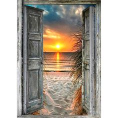 an open door leading to the beach at sunset