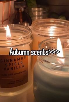 three candles sitting next to each other with the words autumn sents > > >