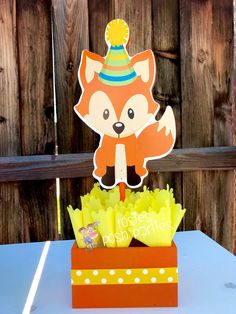 a birthday card with an image of a fox in a hat on top of a box