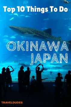 people standing in front of an aquarium with the words top 10 things to do in okinawa japan