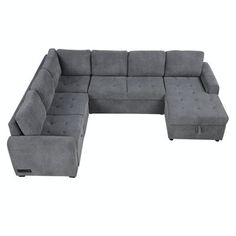 a gray sectional couch with two ottomans and one footstool on the bottom right side