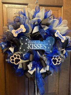 a blue and white wreath with dog's name on it