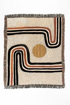 a square rug with an abstract design on it