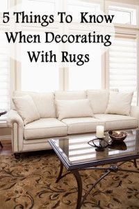 a living room with couches and coffee table in front of the window that says, 5 things to know when decorating with rugs