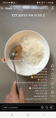 someone is eating rice in a bowl with a spoon