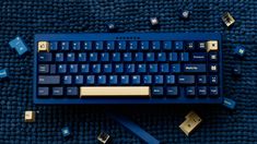 a blue keyboard and some dice on a blue carpet