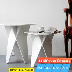 two white tables sitting next to each other on top of a gray floored floor