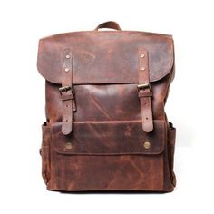 Dark brown leather backpack Classic Brown Leather Backpack With Waxed Finish, Classic Brown Rectangular Backpack, Brown Waxed Finish Standard Backpack, Brown Leather Backpack With Waxed Finish For Everyday, Brown Waxed Leather Satchel Backpack, Classic Brown Leather Backpack For Everyday, Brown Waxed Backpack For Everyday Use, Luxury Brown Backpack With Leather Backing, Classic Brown Backpack With Adjustable Strap