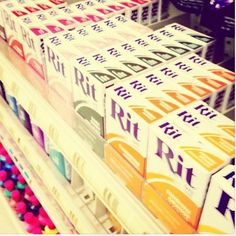 several boxes of fruit sit on display in a store