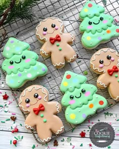 decorated cookies are sitting on a cooling rack