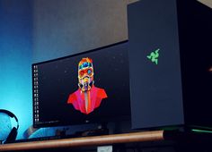 a computer monitor sitting on top of a wooden desk