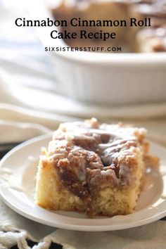 a piece of cinnamon roll cake on a plate with the rest of the cake in the background