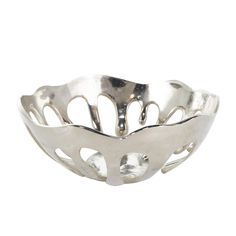 a metal bowl with holes in the middle