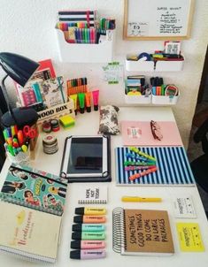 the desk has many school supplies on it