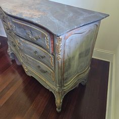 an old dresser is sitting on the floor