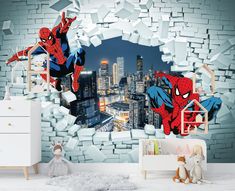 a room with a spiderman wall mural in it