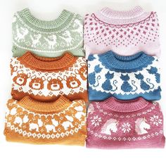 four knitted sweaters in different colors on a white background with an elephant motif