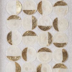 several circles with gold foil on white fabric