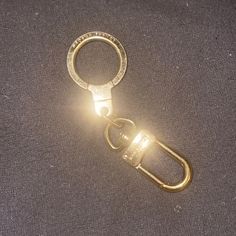 Lv Keychain Extender. Great Condition. You Can See A Few Scratches, But This Item Is Very Clean And Shiny. No Tarnish. I Used It To Extend A Strap, And I Also Used It To Attach Purse Charms. The Pictures Do Not Do It Justice. 3 1/2 “ From Tip To Tip Lv Keychain, Louis Vuitton Keychain, Louis Vuitton Accessories, Purse Charms, Key Card Holder, Card Holders, Charms, Conditioner, Louis Vuitton