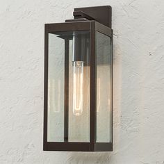 an outdoor wall light with two bulbs on it