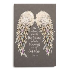 an angel wings with bible verse on the front and back of it, against a gray background