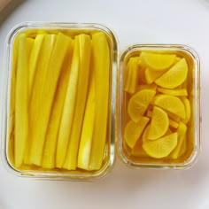 two plastic containers filled with sliced yellow bananas