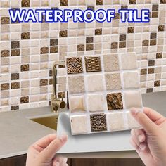 a person is holding a tile in front of a kitchen counter with the words waterproof tile on it