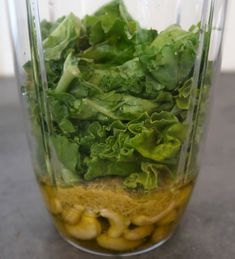 lettuce and other vegetables in a blender