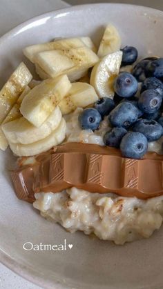 oatmeal with bananas and blueberries in a bowl